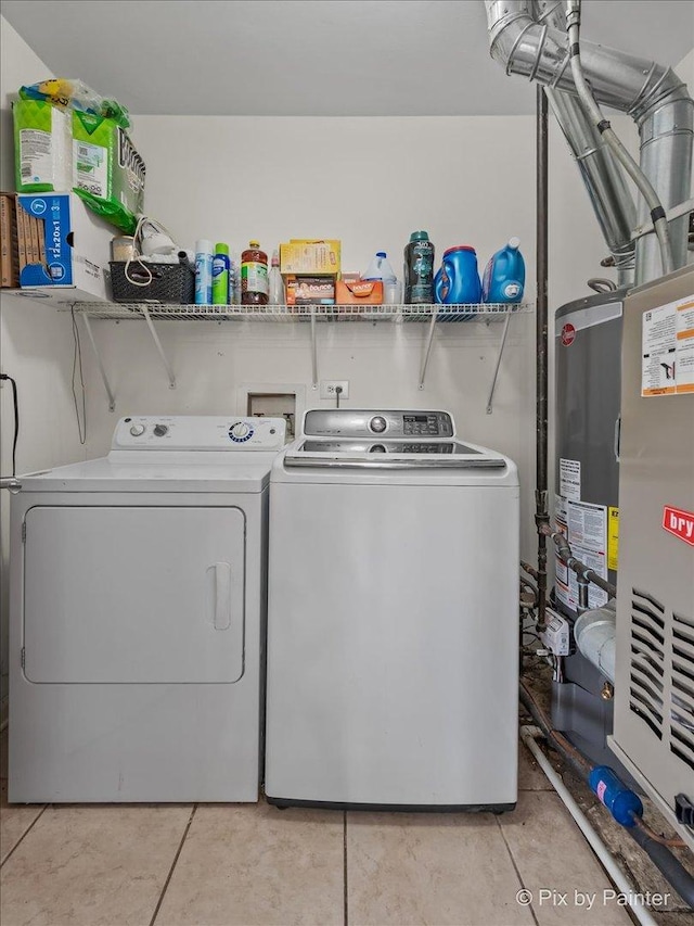 washroom with washer and clothes dryer and laundry area