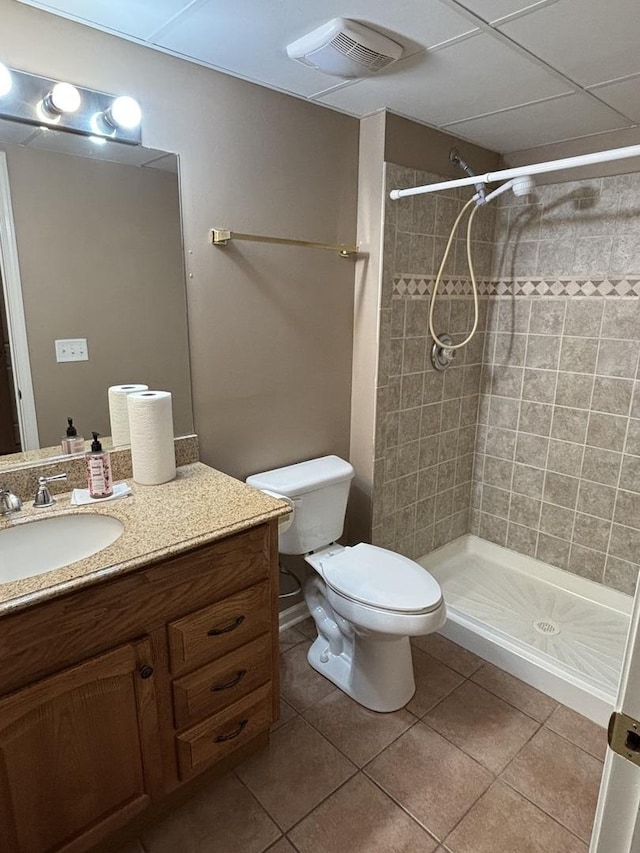 full bath featuring a stall shower, visible vents, toilet, tile patterned flooring, and vanity