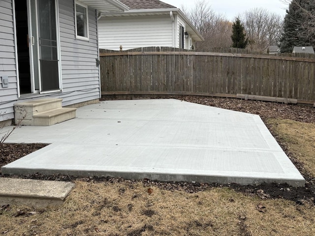 view of patio / terrace featuring entry steps and fence