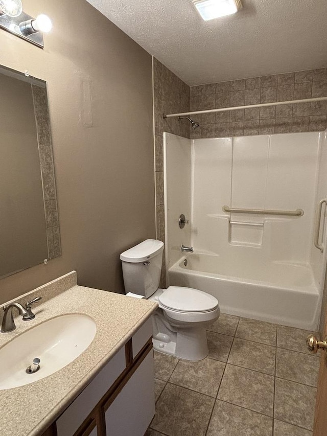 full bathroom with toilet, tile patterned flooring, bathtub / shower combination, a textured ceiling, and vanity