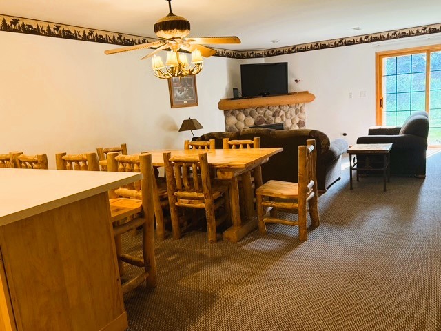 2643 N Il Route 178th Hwy Unit 2-2, Utica, IL 61373 - dining space featuring a ceiling fan, carpet floors, and a fireplace