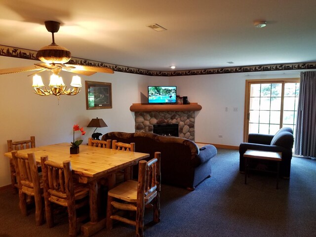 2643 N Il Route 178th Hwy Unit 2-2, Utica, IL 61373 - carpeted dining area with a stone fireplace, a ceiling fan, and baseboards