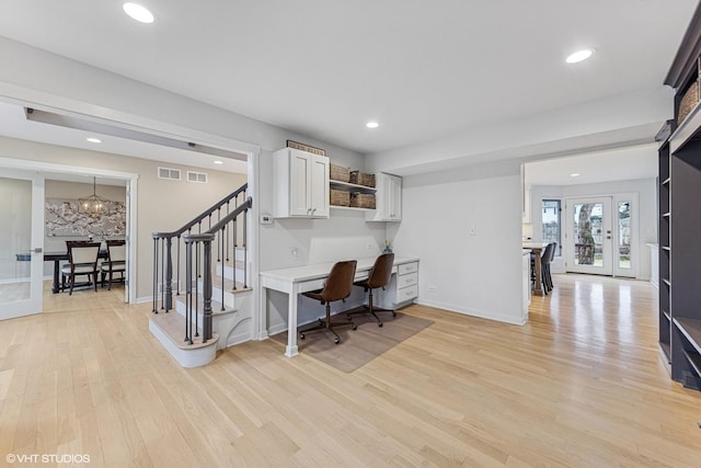 home office with french doors, built in desk, recessed lighting, visible vents, and light wood-type flooring