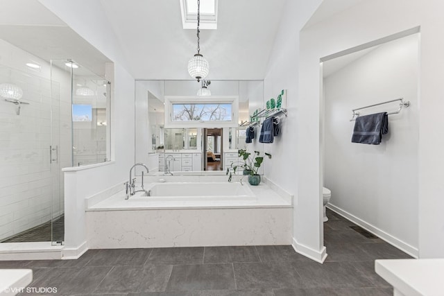 bathroom featuring a bath, a shower stall, toilet, and tile patterned floors