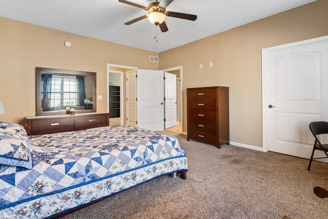 bedroom featuring a ceiling fan, carpet, visible vents, and baseboards