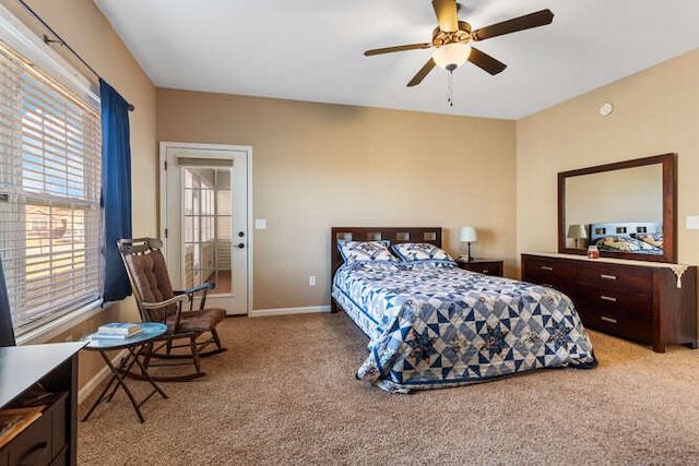 bedroom with light colored carpet and baseboards