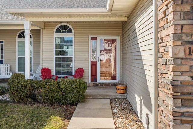 doorway to property with covered porch