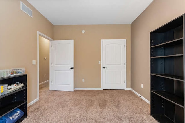 bedroom with visible vents, baseboards, and carpet floors