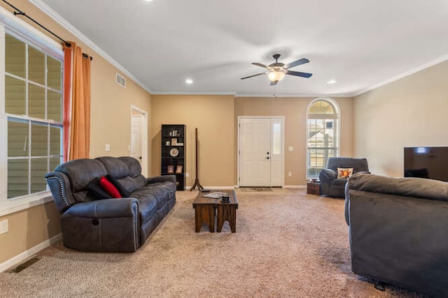 living room with baseboards, carpet, visible vents, and ornamental molding