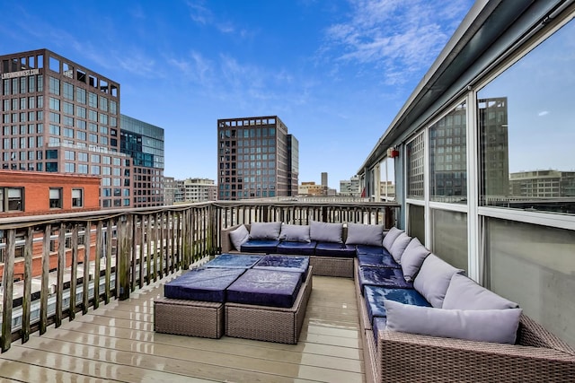 deck featuring a view of city and an outdoor hangout area