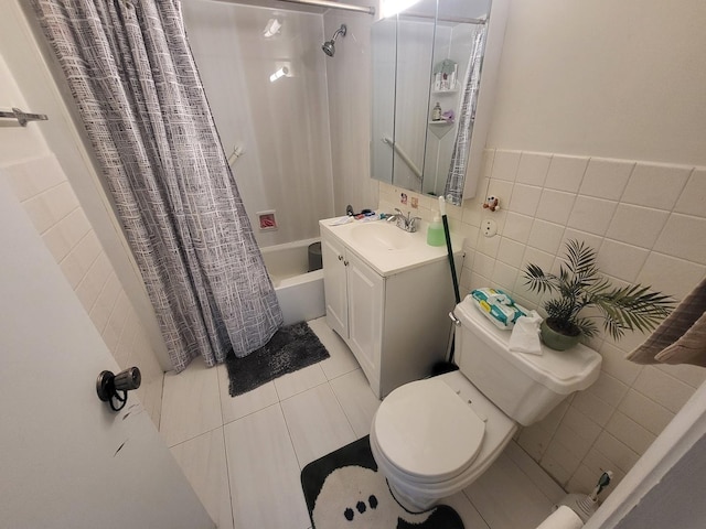 full bath with toilet, tile patterned floors, shower / bath combination with curtain, vanity, and tile walls