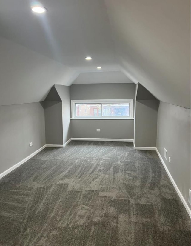 bonus room featuring vaulted ceiling, recessed lighting, dark carpet, and baseboards