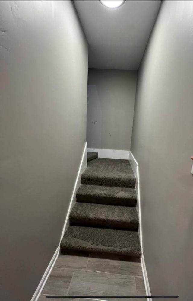 stairway with baseboards