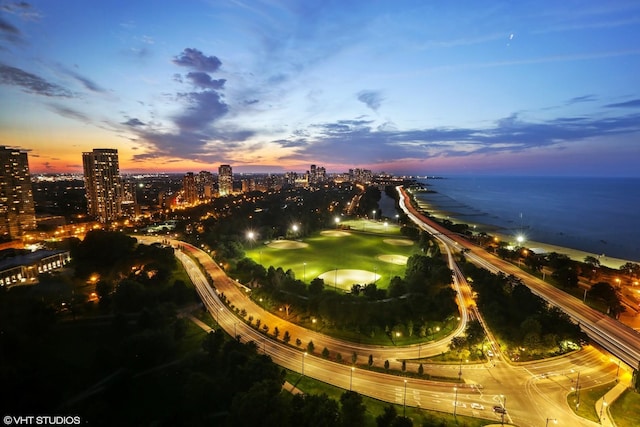 aerial view at dusk with a water view