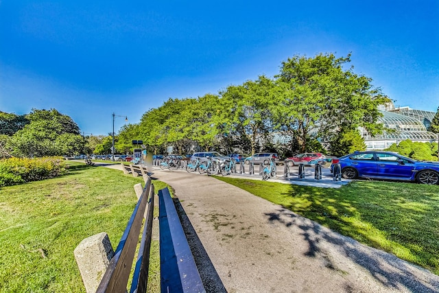 view of property's community featuring a yard