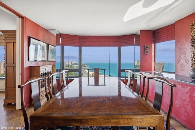 dining area with a water view and plenty of natural light