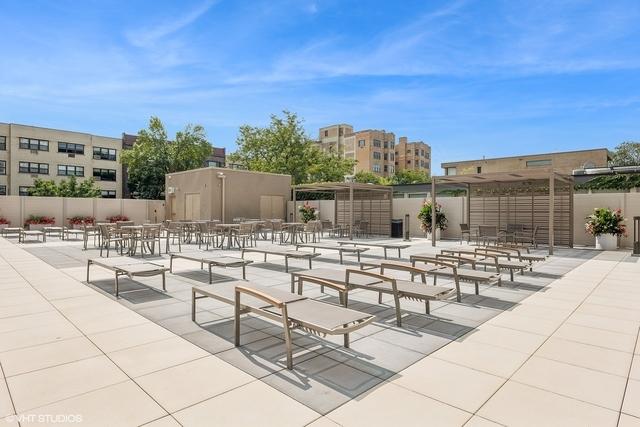 view of property's community featuring fence and a patio