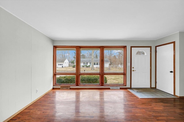 interior space featuring wood finished floors and visible vents