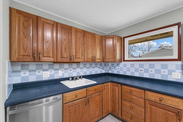 kitchen with a sink, dark countertops, brown cabinetry, and dishwasher