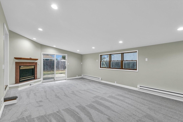 unfurnished living room featuring a baseboard heating unit, carpet floors, vaulted ceiling, and a brick fireplace