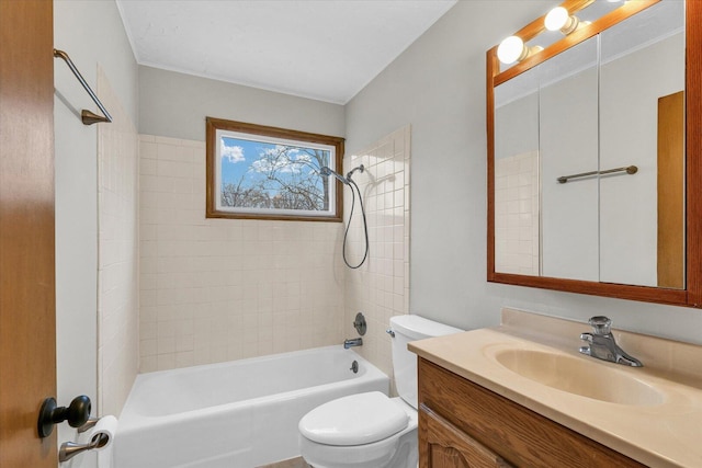 bathroom featuring vanity, bathtub / shower combination, and toilet