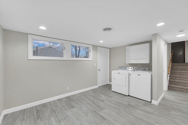 laundry area with recessed lighting, visible vents, baseboards, light wood finished floors, and washing machine and clothes dryer