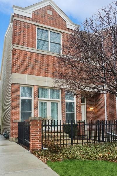 view of front facade featuring a fenced front yard and brick siding