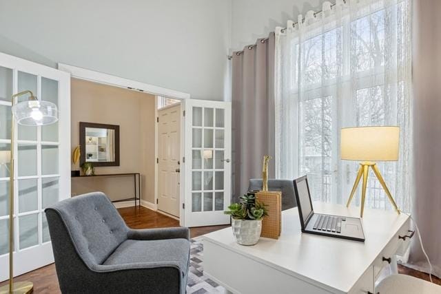 living area featuring french doors and wood finished floors