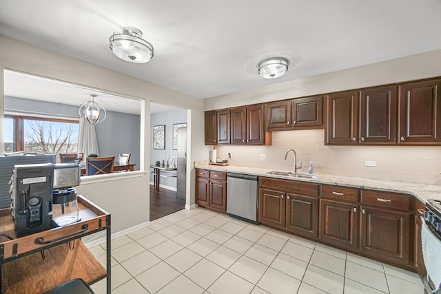 kitchen with dishwasher, backsplash, a sink, and dark brown cabinets