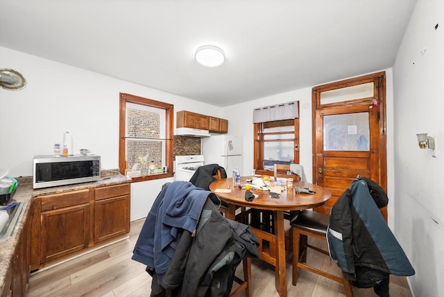 dining room with light wood-style floors