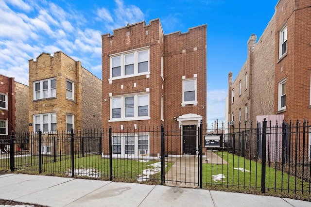 view of front facade featuring brick siding, a fenced front yard, and a front lawn