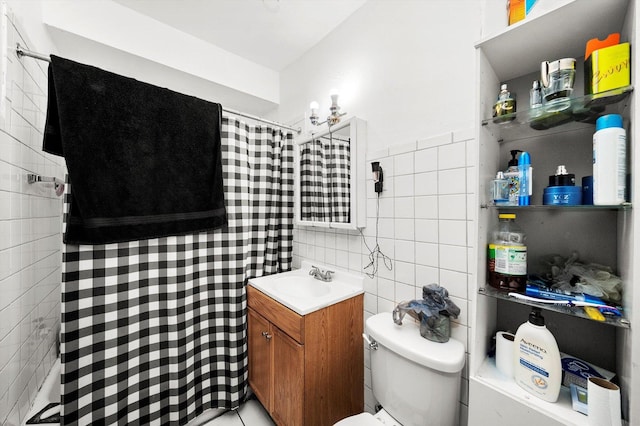 bathroom with toilet, tile walls, a shower with shower curtain, and vanity