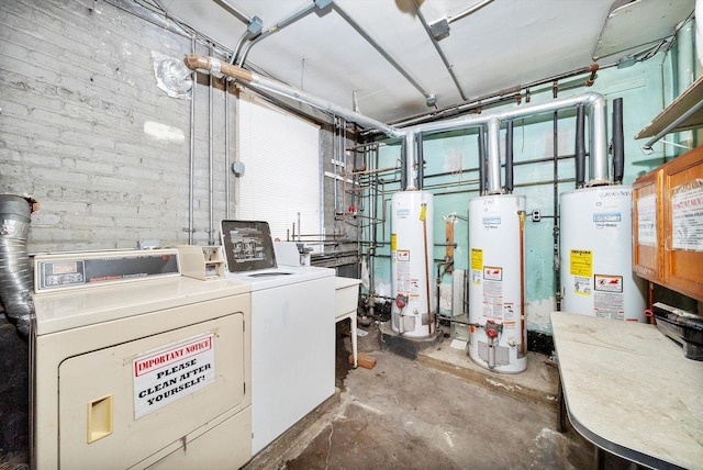 utility room featuring water heater and washer and dryer