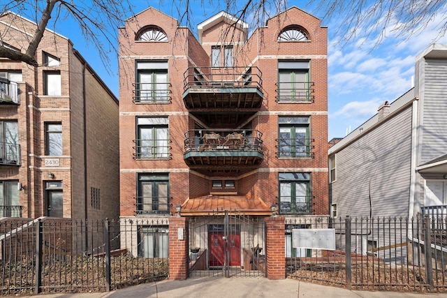 view of building exterior with fence