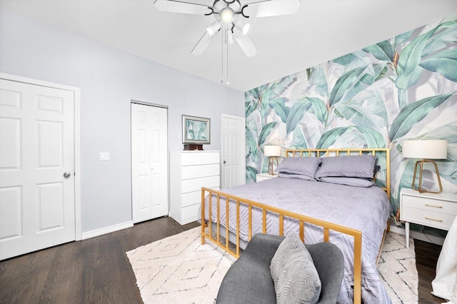 bedroom with a ceiling fan, baseboards, and wood finished floors