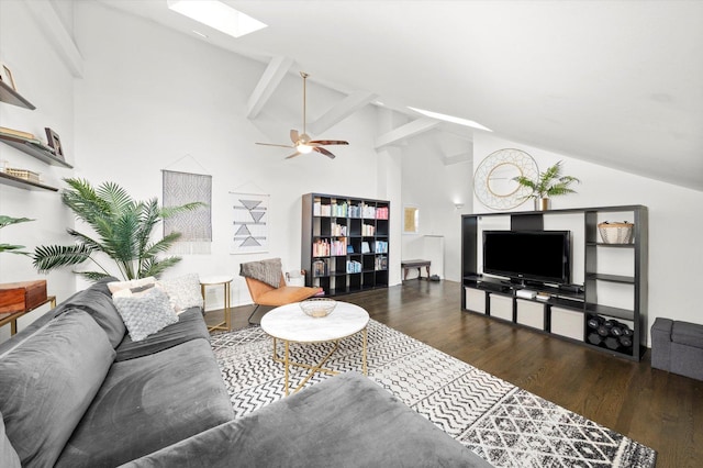 living area with ceiling fan, high vaulted ceiling, a skylight, and wood finished floors