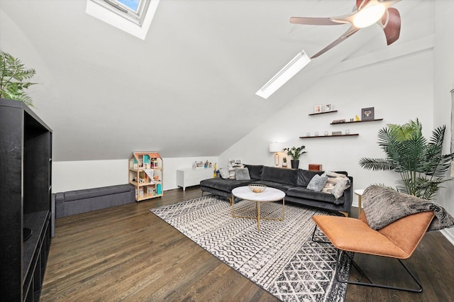 living room featuring lofted ceiling with skylight, ceiling fan, and wood finished floors