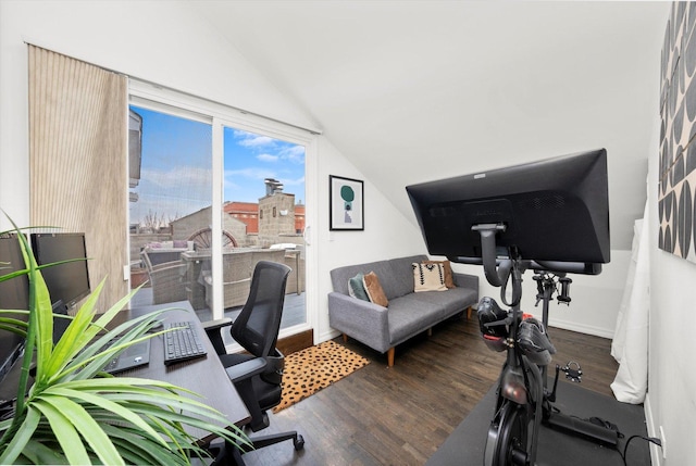 office featuring lofted ceiling, baseboards, and wood finished floors