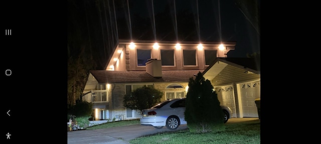 view of front facade with driveway and a garage