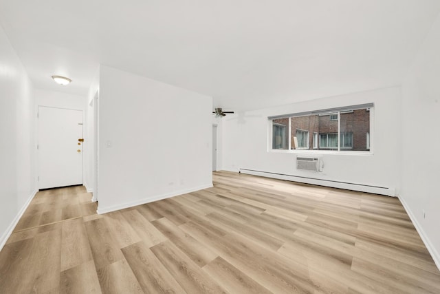 unfurnished living room featuring light wood finished floors, a baseboard radiator, and baseboards