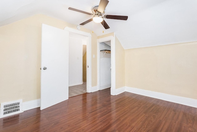 additional living space with baseboards, visible vents, a ceiling fan, lofted ceiling, and wood finished floors