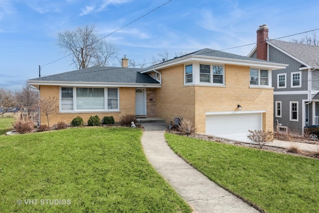 tri-level home featuring brick siding, a chimney, and a front lawn