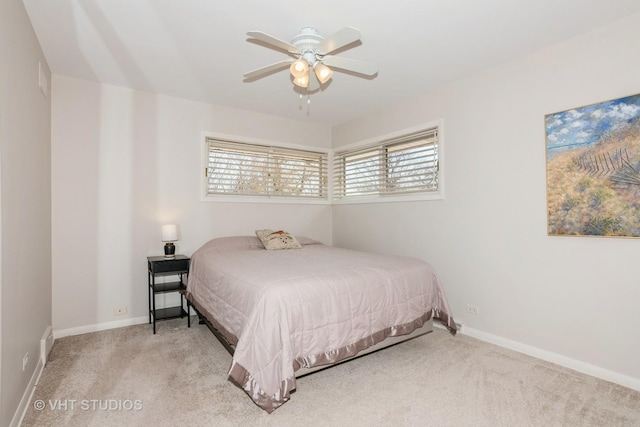 bedroom with carpet flooring, baseboards, and ceiling fan