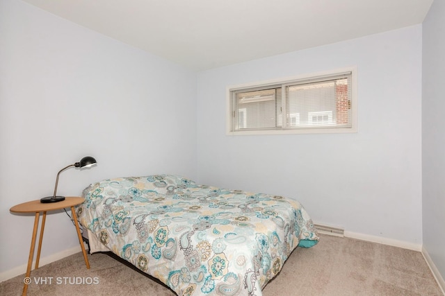 bedroom with baseboards and carpet