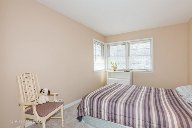 carpeted bedroom with baseboards