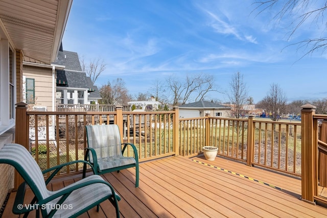 wooden deck featuring a residential view