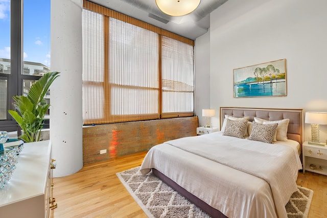 bedroom with wood finished floors