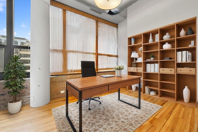 office space featuring wood finished floors