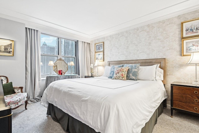 carpeted bedroom with ornamental molding and wallpapered walls