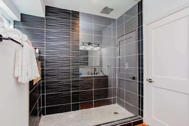 bathroom with a tile shower